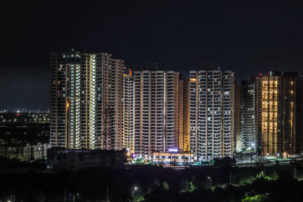 high-angle-view-of-illuminated-buildings-at-night-greater-noida-uttar-pradesh-india